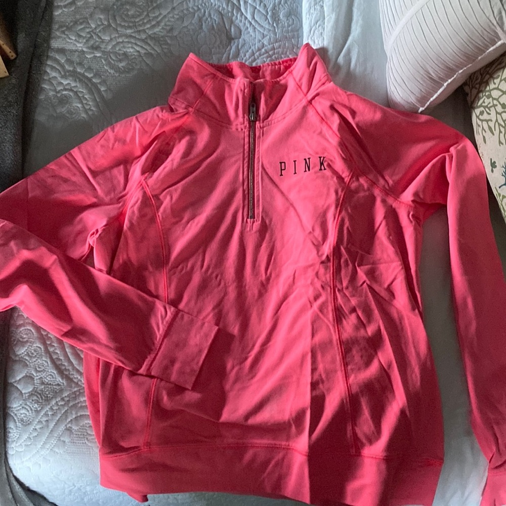 PINK bright pink quarter zip with skulls on the collar